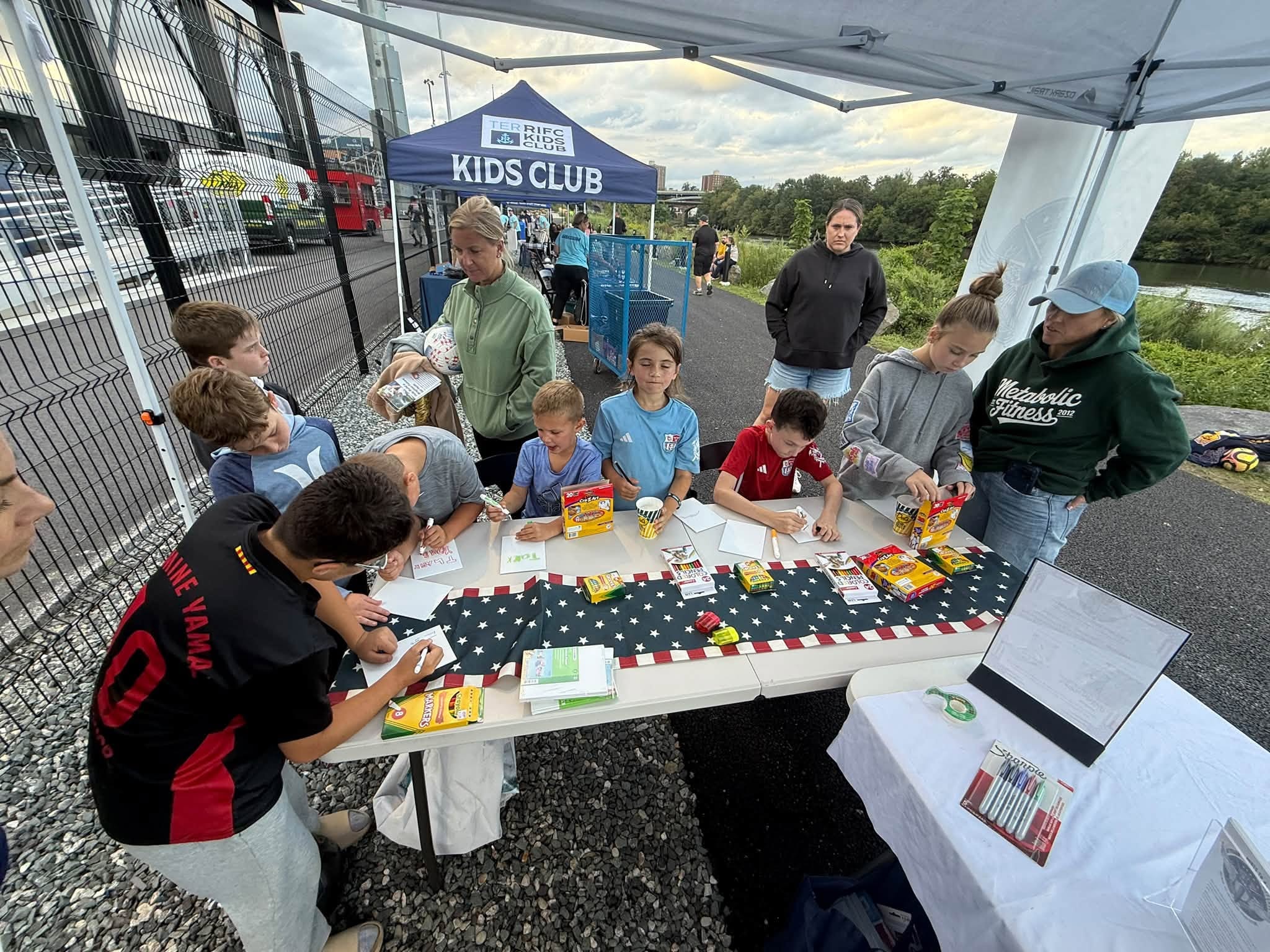 Kids club outdoor activity at event tent