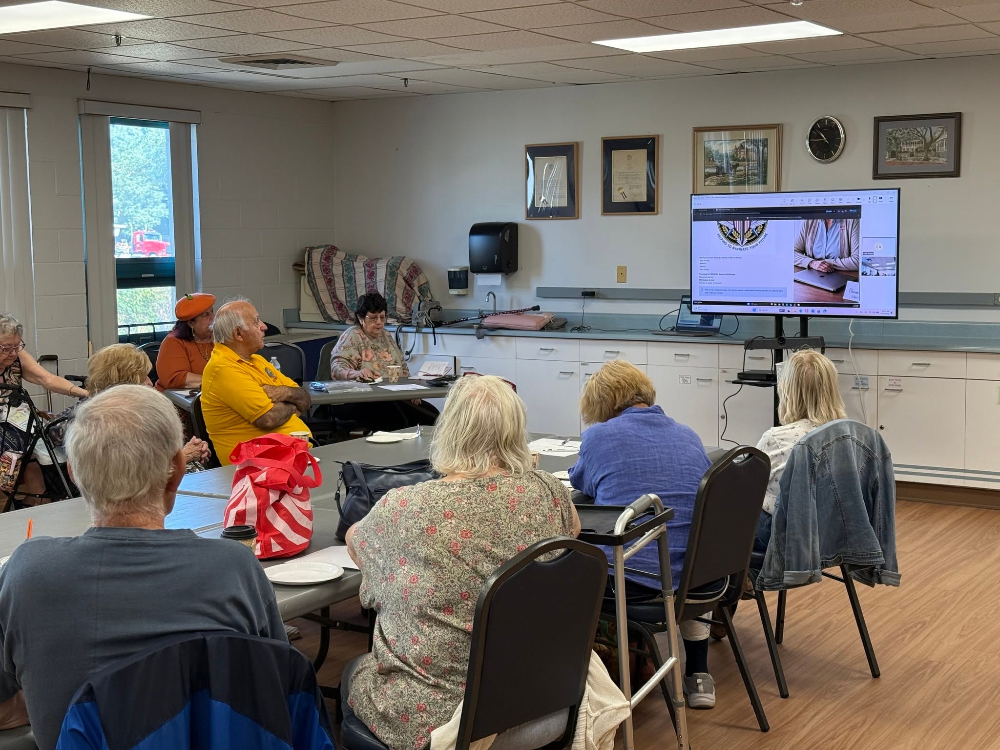 Senior group watching presentation on screen