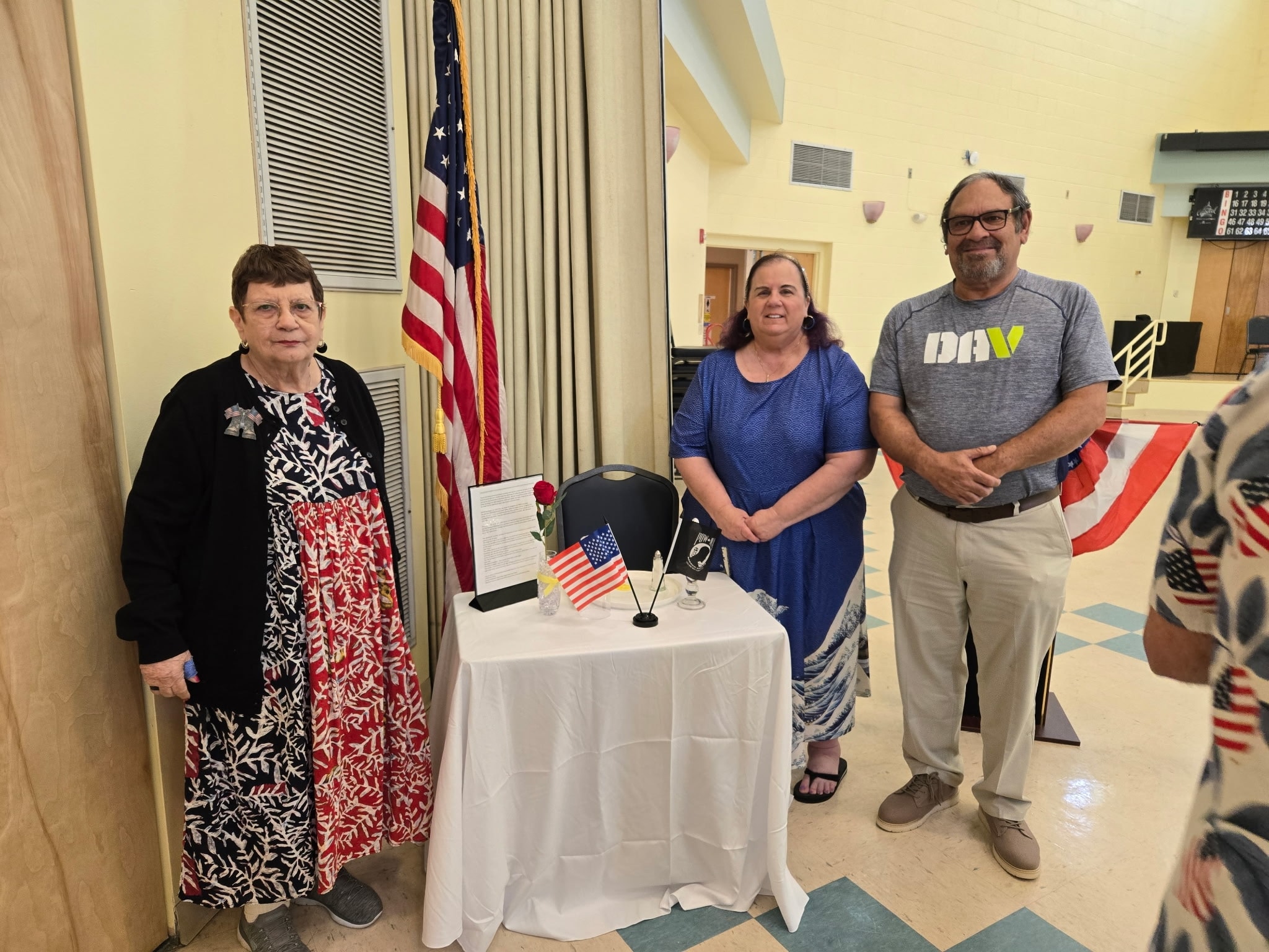 Three people at patriotic community event